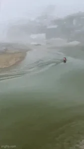 a man sliding down with a flood