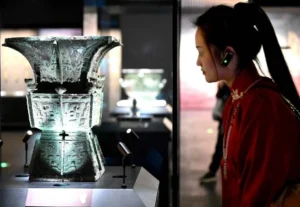 a lady is watching relics at Yinxu Museum