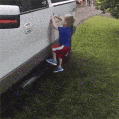a brother is opening the car door for his young sister