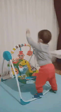 a baby get on a swing cradle in a smart way